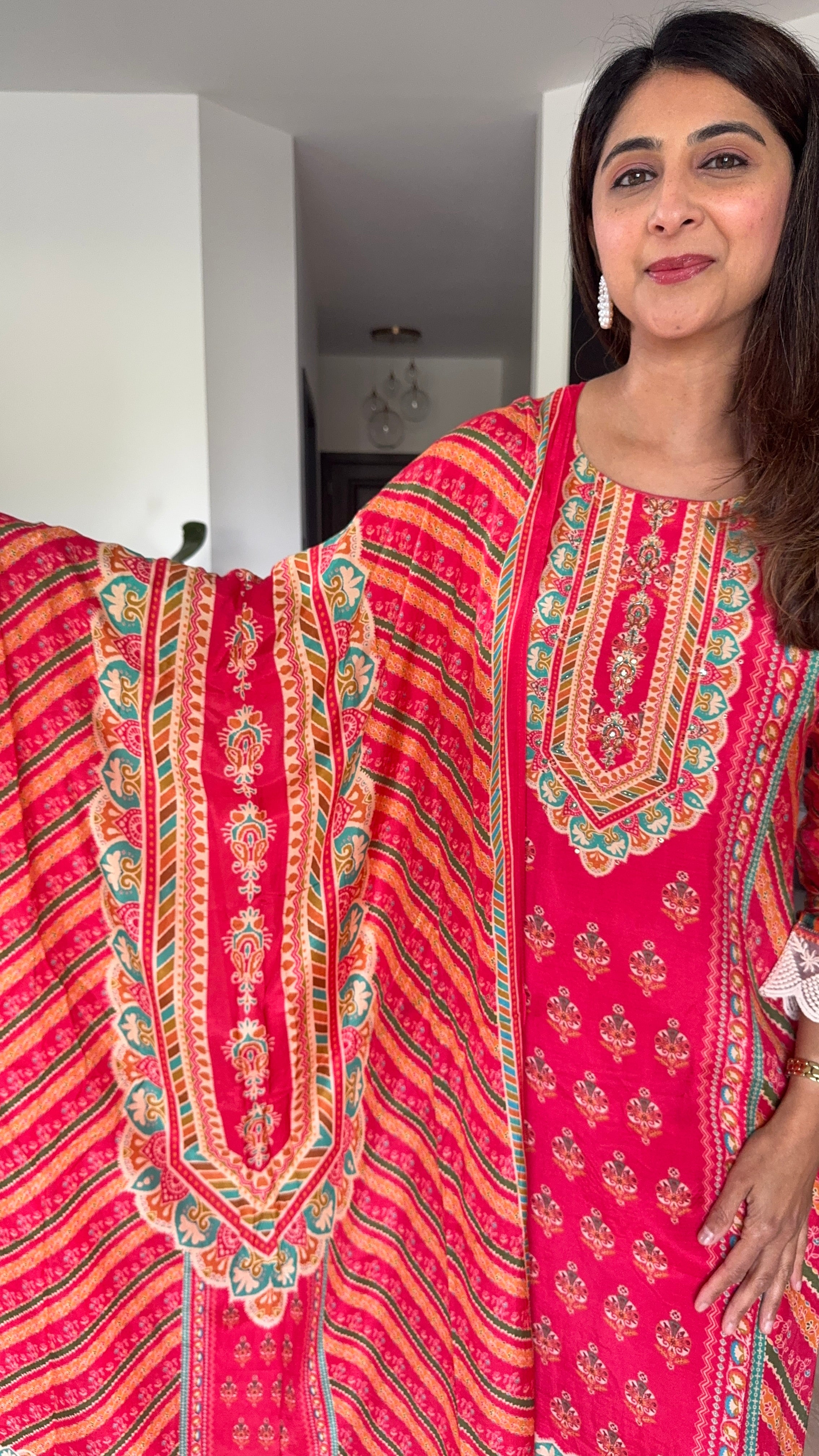 Bright red printed muslin kurta set with lace detailing