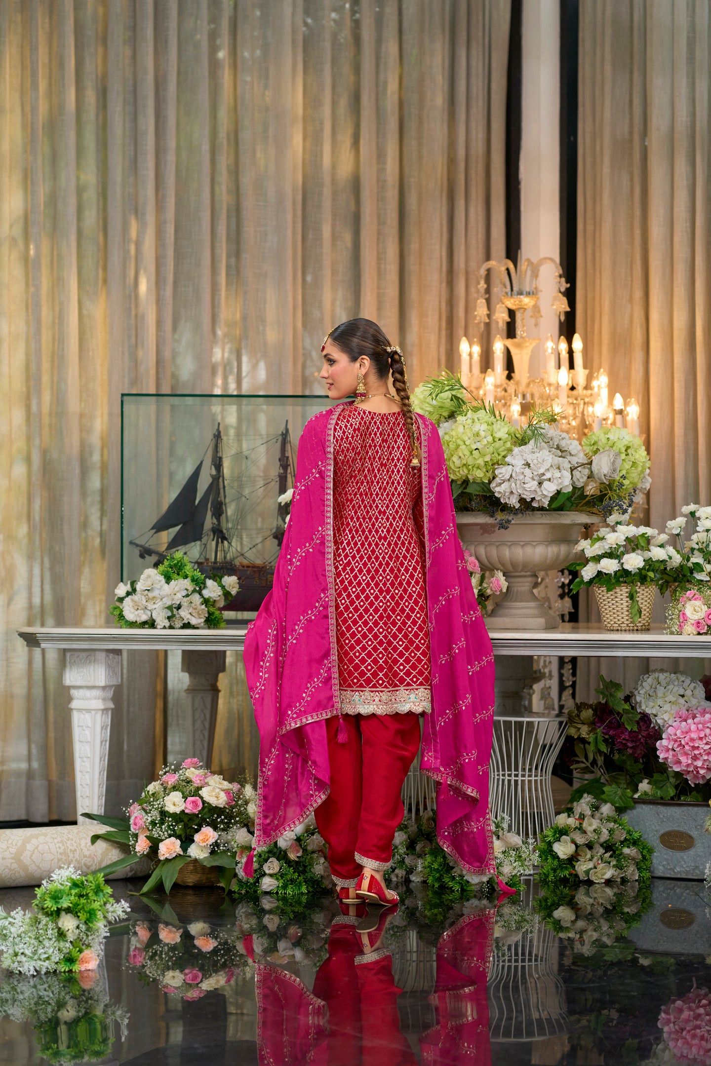 Red kurta and dhoti set with pink dupatta