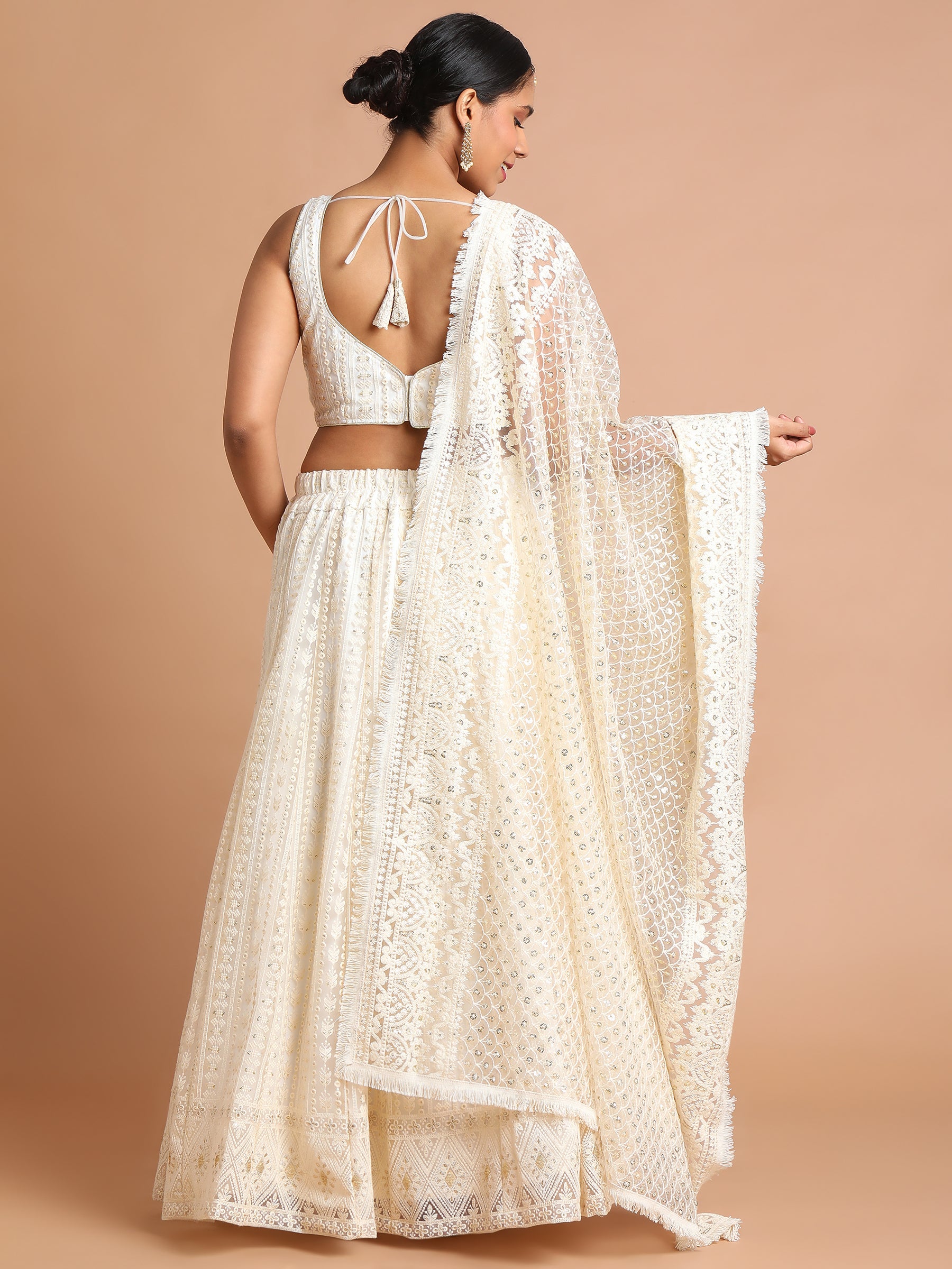 Cream embroidered net lehenga set