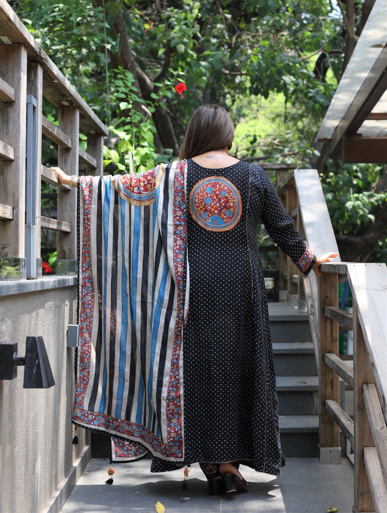 Black bandhni printed kurta with pants and floral dupatta