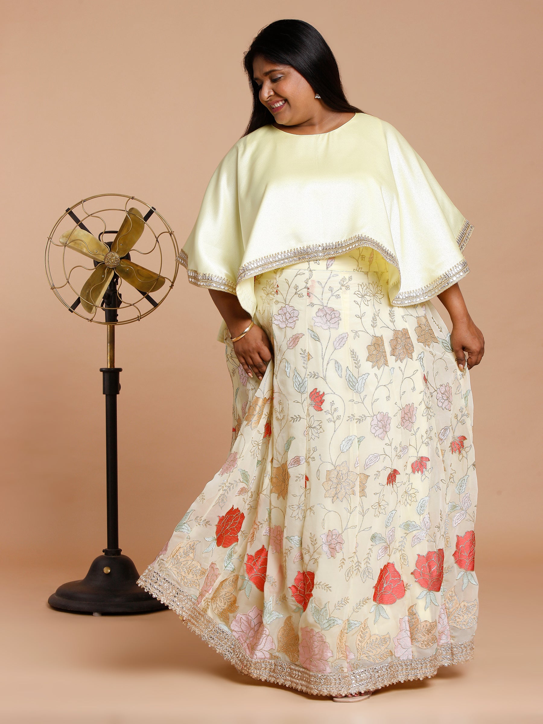 Yellow cape with floral embroidered skirt