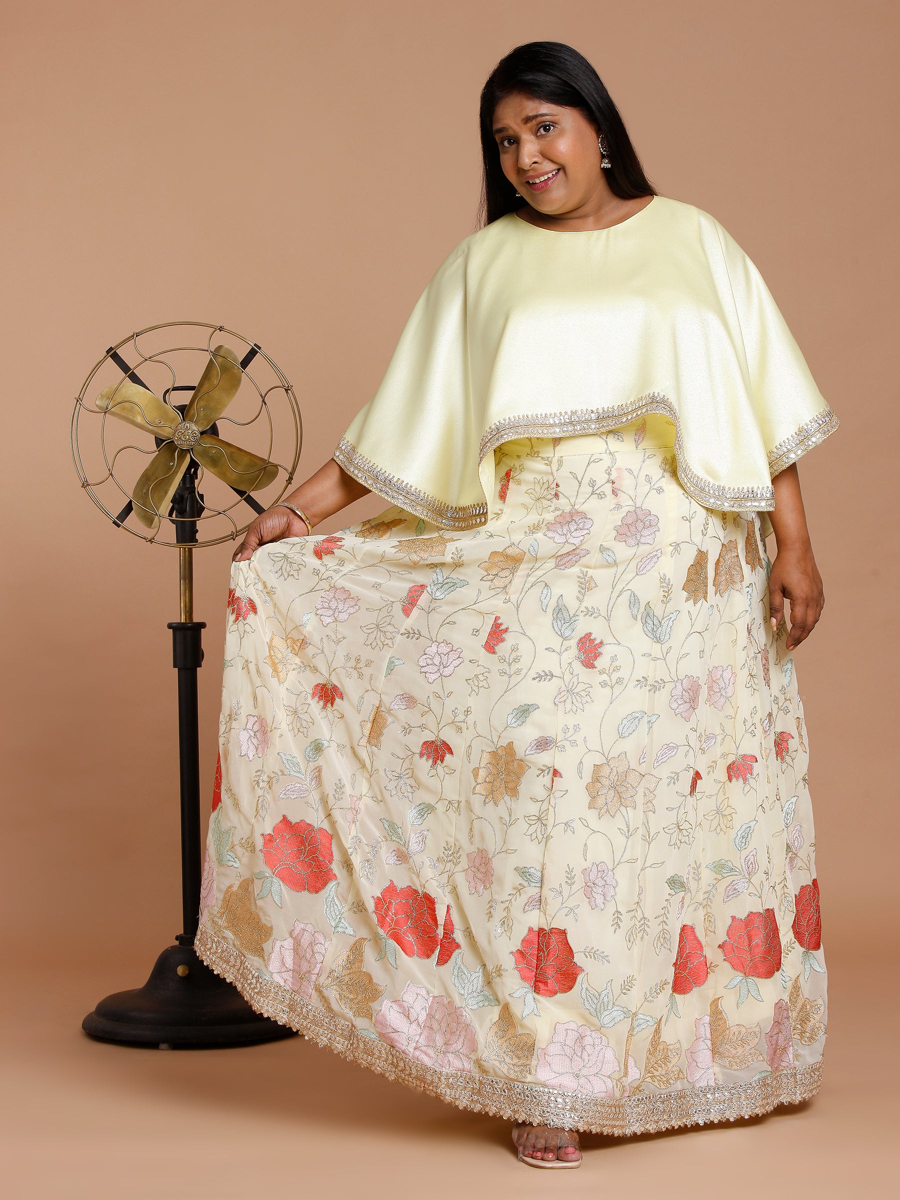 Yellow cape with floral embroidered skirt