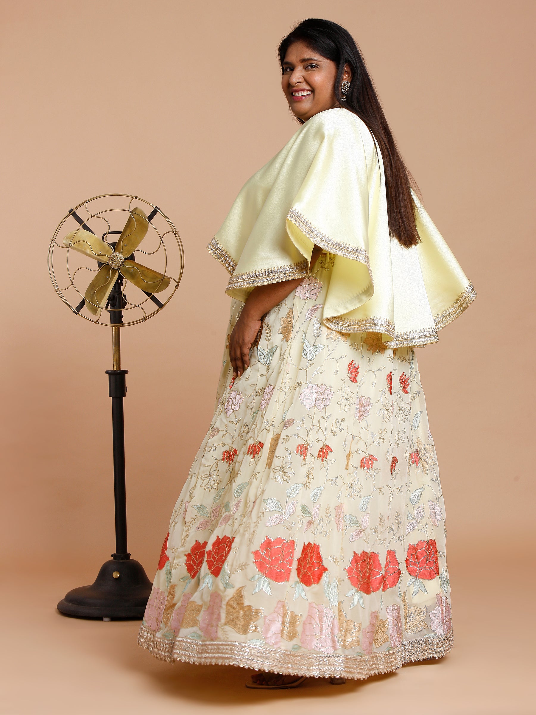 Yellow cape with floral embroidered skirt